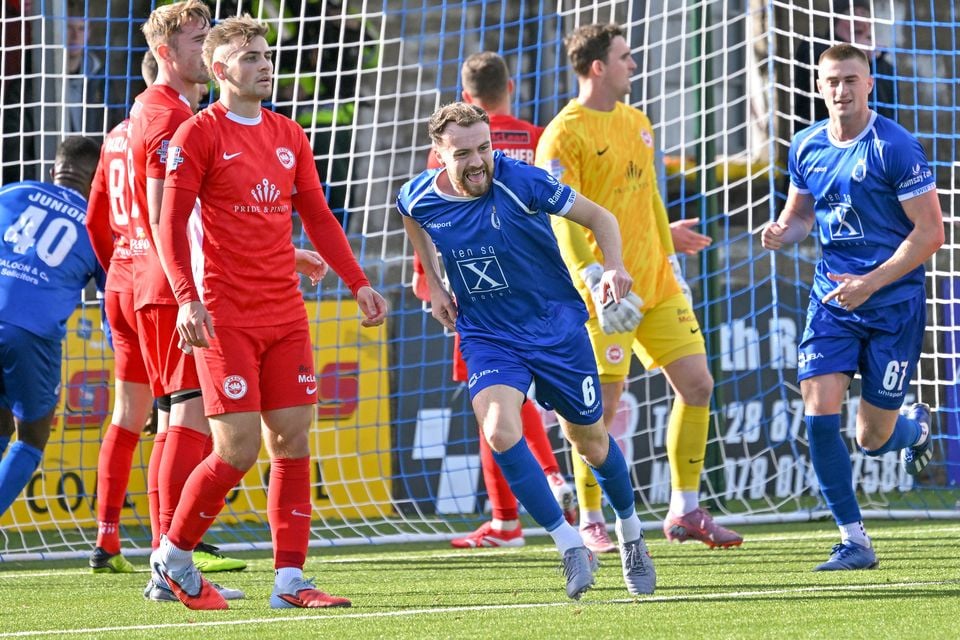 Tiernan Kelly wheels away in delight after putting Dungannon ahead against Larne
